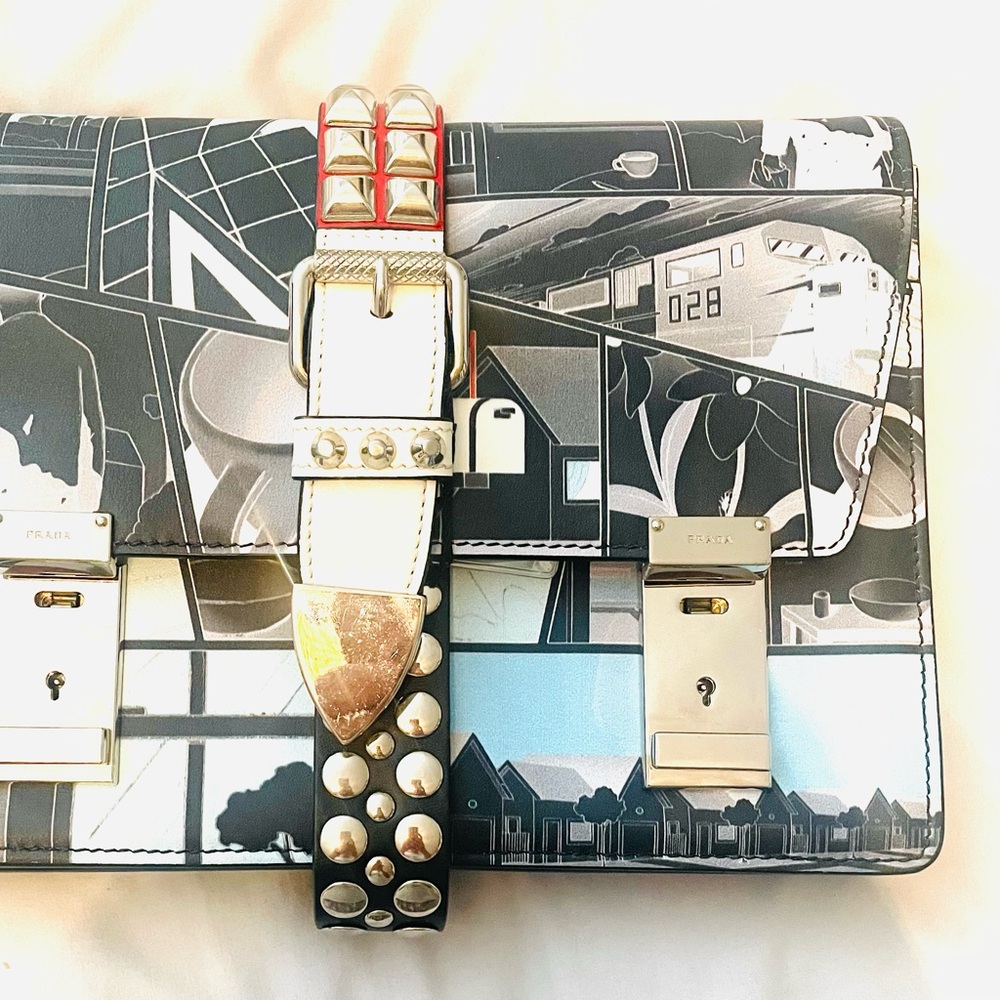 Prada Graphic Print Clutch with Studded Strap